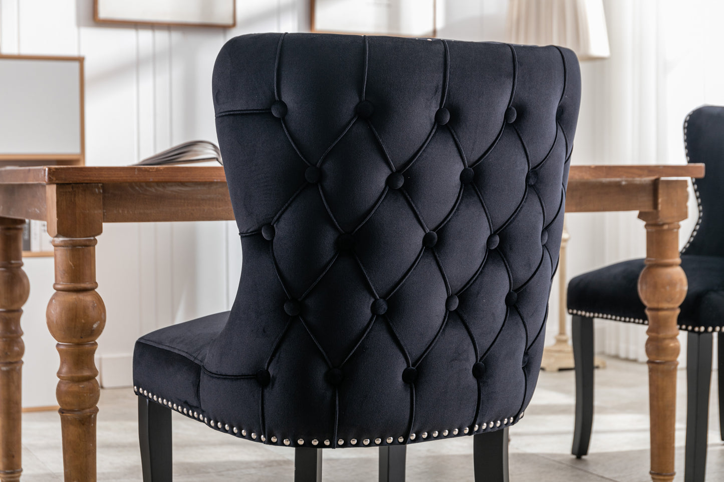 Set of 2 Black Velvet upholstered wing-back dining chair with backstitching nailhead trim and solid wood legs