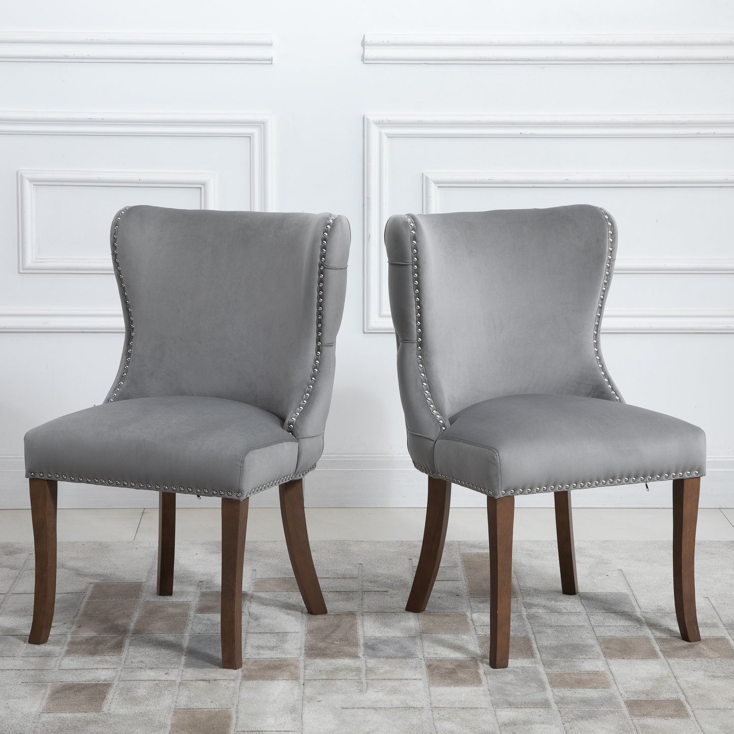 Set of 2 upholstered wing-back dining chair with backstitching nailhead trim and solid wood legs