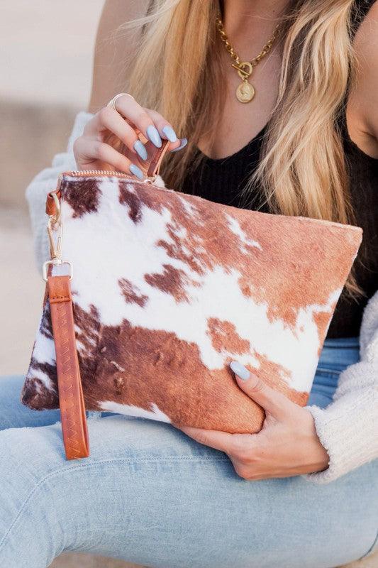 Faux Fur Cow Animal Print Clutch by VYSN