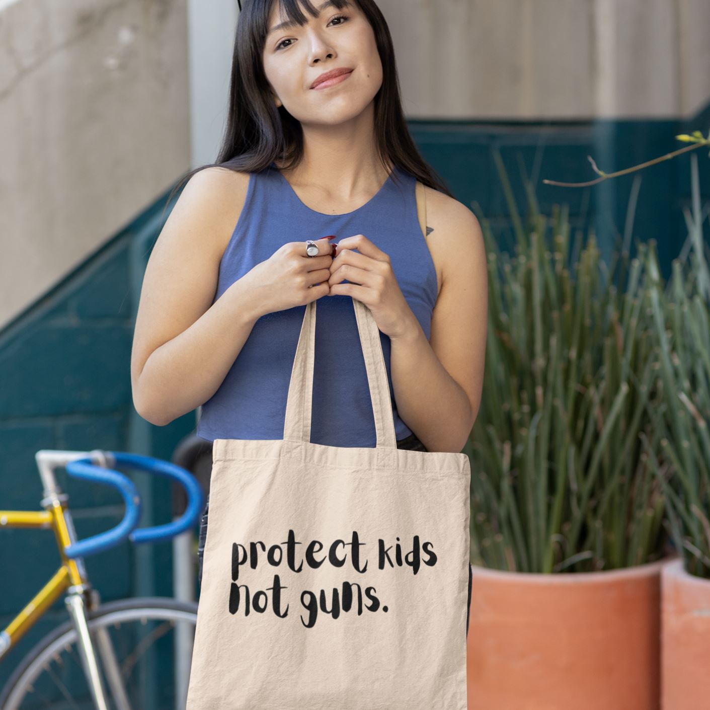 Protect Kids Not Guns | Tote Bag by The Happy Givers