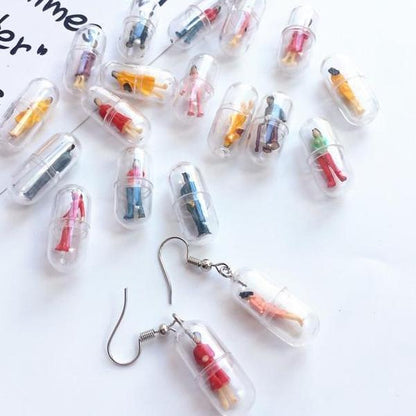 Human Capsule Earrings by White Market