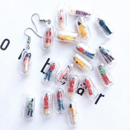 Human Capsule Earrings by White Market