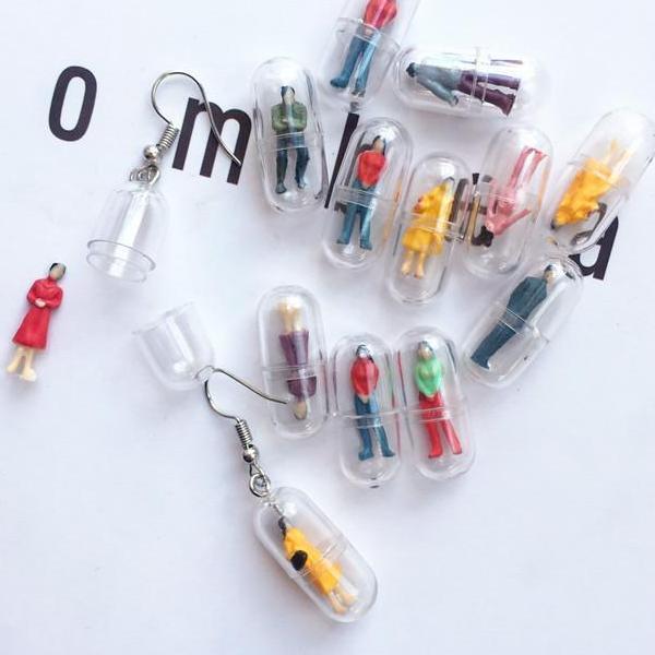 Human Capsule Earrings by White Market