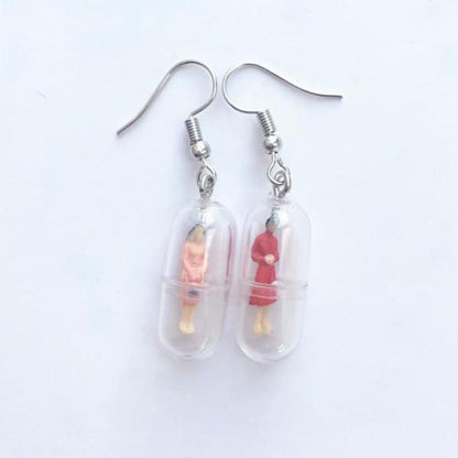 Human Capsule Earrings by White Market